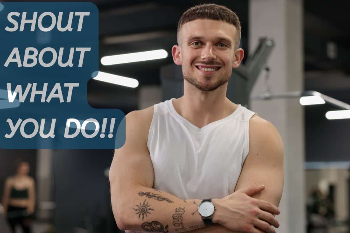 Enthusiastic personal trainer empowering clients with fitness guidance at a modern gym, promoting health, strength, and motivation through personalised training sessions.